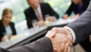 A close-up of a handshake between two business professionals.
