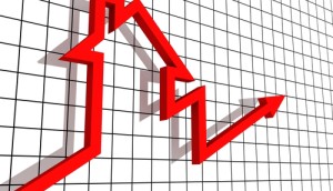 Red arrow forming a house shape on a grid background, symbolizing rising trends in real estate.