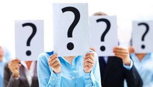 People holding question marks over their faces, symbolizing uncertainty or anonymity.